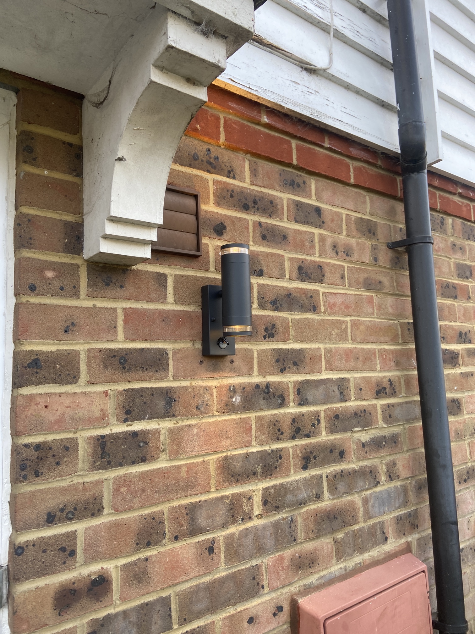 Black Up down light by Side Door